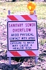 Sanitary Sewage Overflow - Avoid Physical Contanct With Area - Exposure to Water May Cause a Health Risk